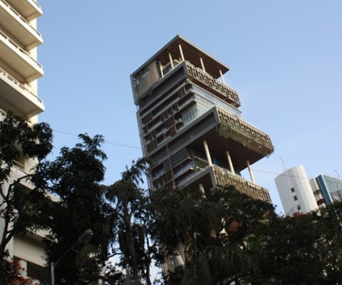 The $1 billion (£630 million), 27 storey tower block in Mumbai is the home of Mukesh Ambani — the richest man in India, fourth richest man in the world –, his wife and their 3 children. It is difficult to know what to call it. It is far too big and grand to call it a house, the fact that it has more floor space than the palace of Versailles and 600 staff would ordinarily make it a castle